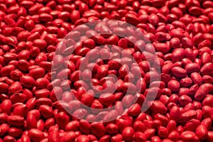 Red polymer dye in granules, background texture