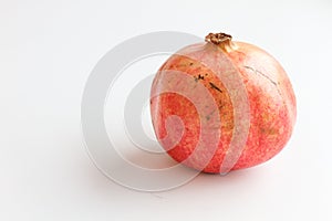 Red pomegranate isolated on white background