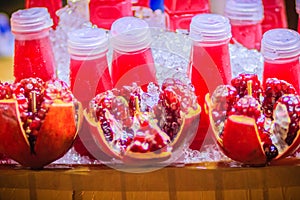 Red pomegranate juice and fresh pomegranate fruit that ready to