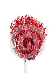 Red pompoms for cheerleaders hold sports cheer.