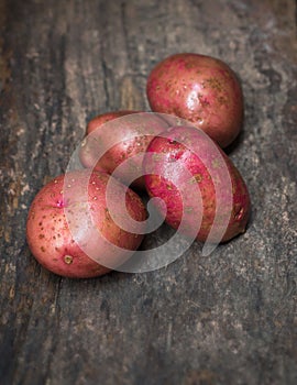 Red pontiac potatoes on a wooden surface