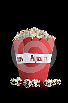 Red popcorn box with popcorn