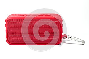 A red portable electronic speaker or radio