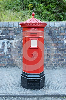 Red post box in city centre of Birmingham, United Kingdom