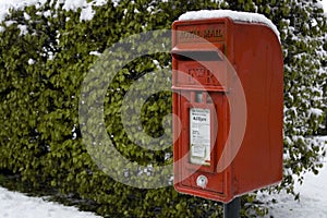 Red post box in the snow