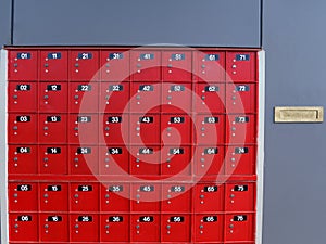 Red post office boxes at a mail centre in New Zealand