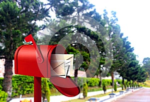 Red postal box on walkway