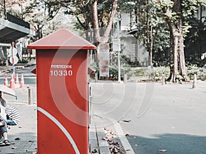 Red postbox for mailing on street side