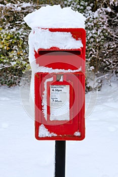 Red postbox in the snow