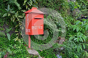 Red postbox, view from the left