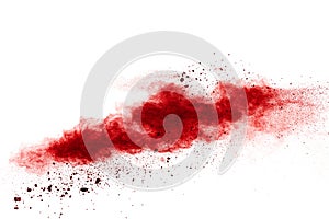 Red powder explosion cloud on white background. Freeze motion of red color dust  particles splashing