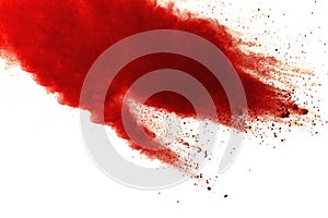 Red powder explosion on white background. Paint Holi