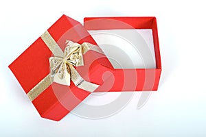 red present box with gold ribbon isolated on white