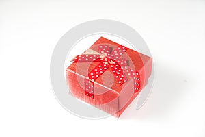 Red present box on white .