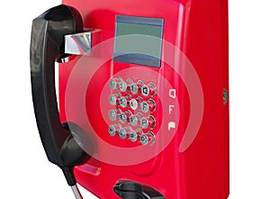 Red public telephone on a white