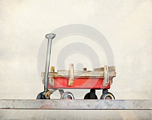 Red pull trolley toys, old rusty wagon, Vintage color tone on pastel style
