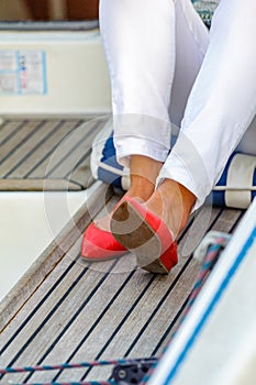 Red pumps on a sailboat