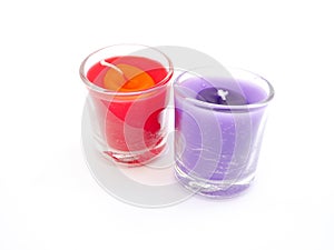 Red and purple candle on isolated