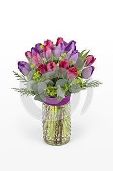 Red and purple tulip flower arrangement. Tulips arranged in a vase for florist.