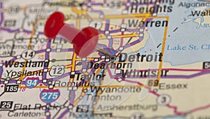 Red push pin pointing on detroit