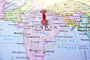 Red Push Pin Pointing India on Location of World Map Close-Up View