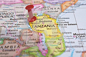 Red Push Pin Pointing Tanzania on Location of World Map Close-Up View