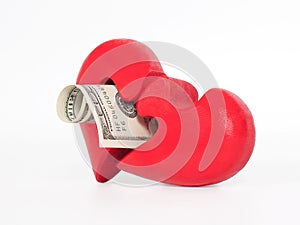 Red puzzle heart and dollar on white