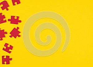 Red puzzle pieces on yellow background. Copy space for your text