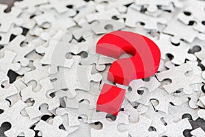 Red Question mark over group of puzzle