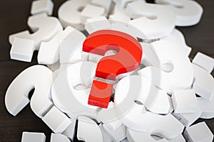 Red Question mark over group of White Question mark , Problem concept