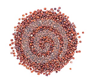 Red quinoa seeds isolated on white background. Pile of raw kinwa. Top view.