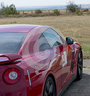 The red racing car a look with a side, a subject motorsport