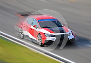 Red racing car in motion