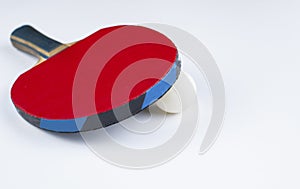 A red racket for table tennis isolated on a white background.Copy space