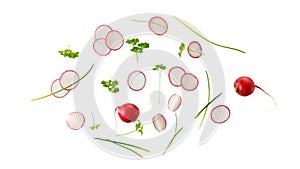 Red radish whole and slices, parsley herb and green onion flying isolated on white