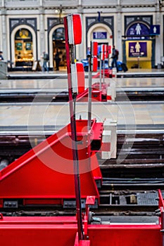 Red railway buffers in Paddington Railway Station, London, UK