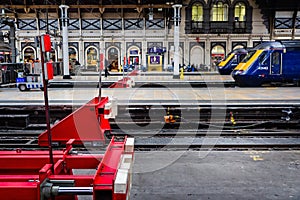 Red railway buffers in Paddington Railway Station, London, UK