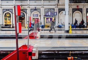 Red railway buffers in Paddington Railway Station, London, UK
