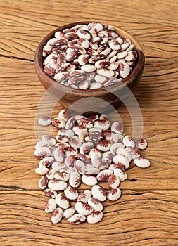 Red rajado beans in a bowl over wooden table