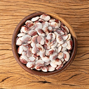 Red rajado beans in a bowl over wooden table photo