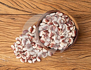 Red rajado beans in a bowl over wooden table photo