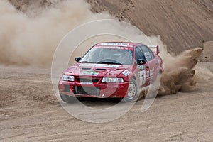 Red rally car Mitsubishi Lancer