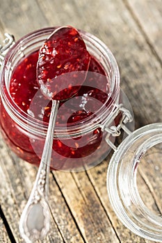 Red rasberries jam in jar