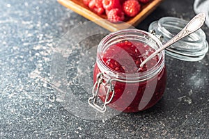 Red rasberries jam in jar