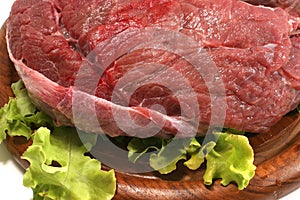Red raw beef meat over white
