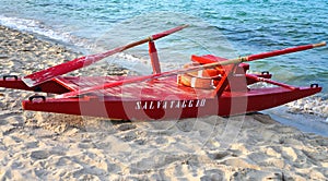 Red rescue boat on an italian beach