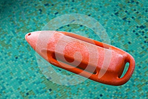 Red rescue buoy in the swimming pool