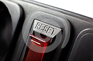 Red reset button. Close up texture