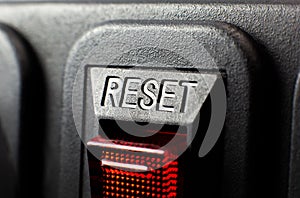 Red reset button. Close up texture