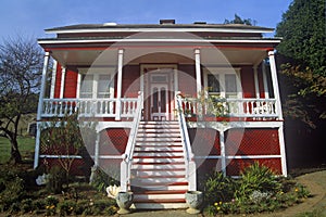 Red residence with white trim, CA